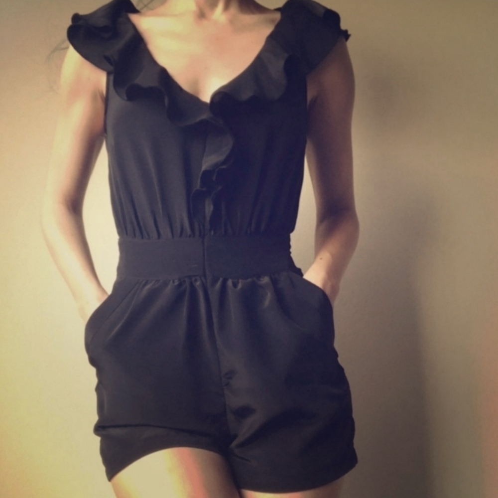 Urban Outfitters Pins and Needles black romper shorts pockets ruffle neckline M